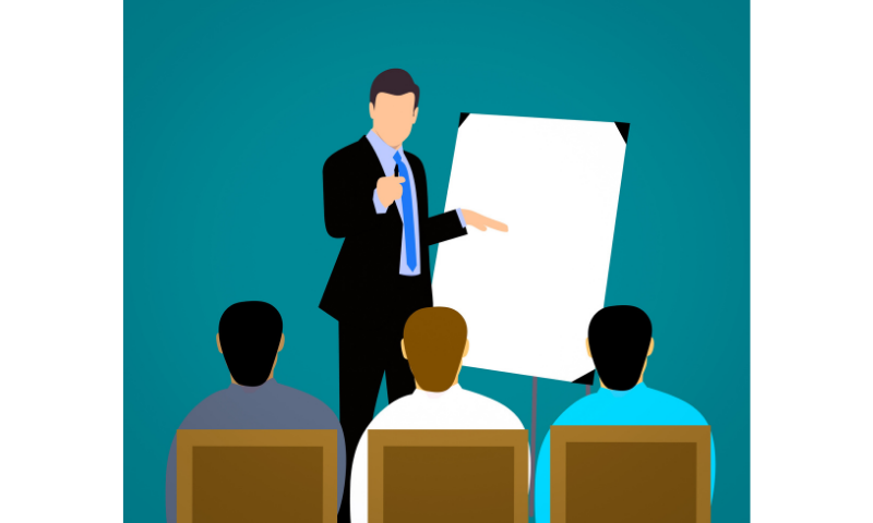 a teacher teaching three pupils.