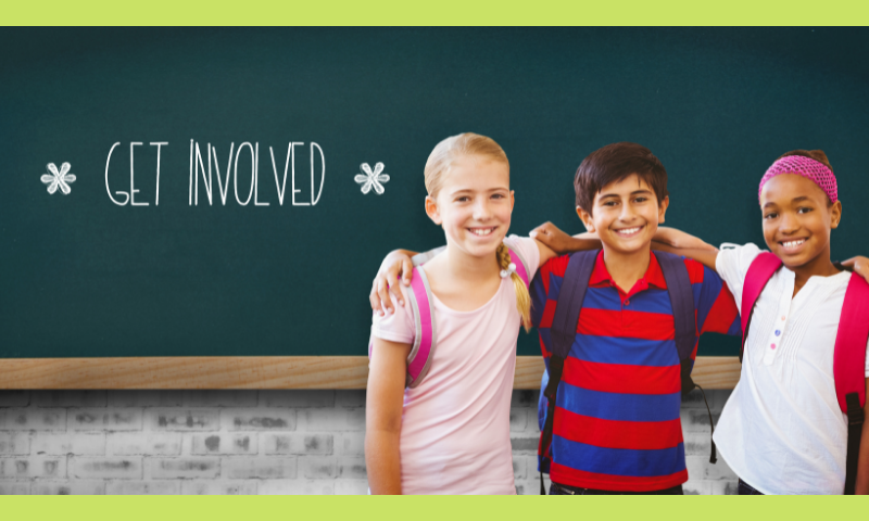 Three children in front of a blackboard 