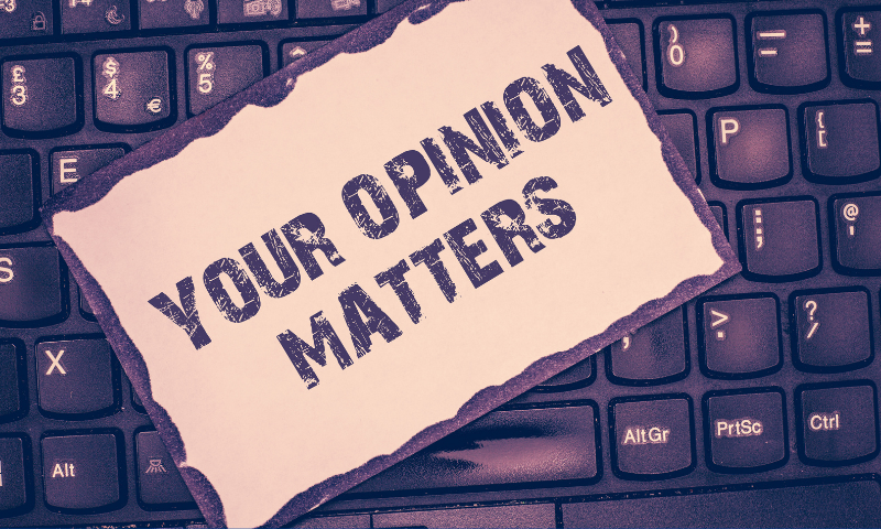 Note on a keyboard reading "Your Opinion Matters"