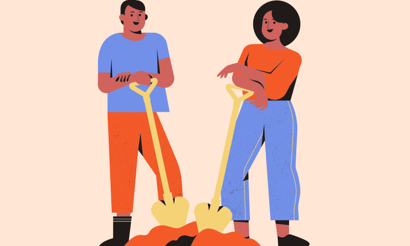 two people digging a hole